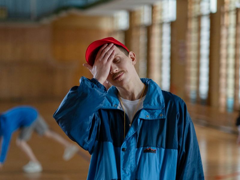 Person in sportswear standing in a modern training hall